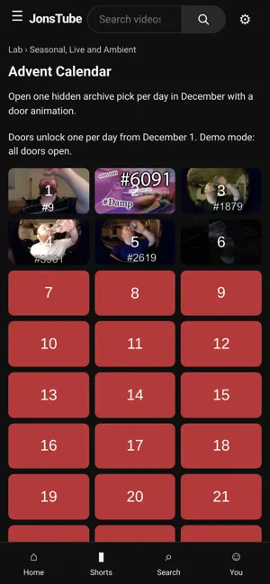 On a phone, the Lab Advent calendar, a grid of numbered doors that each reveal one archive video
